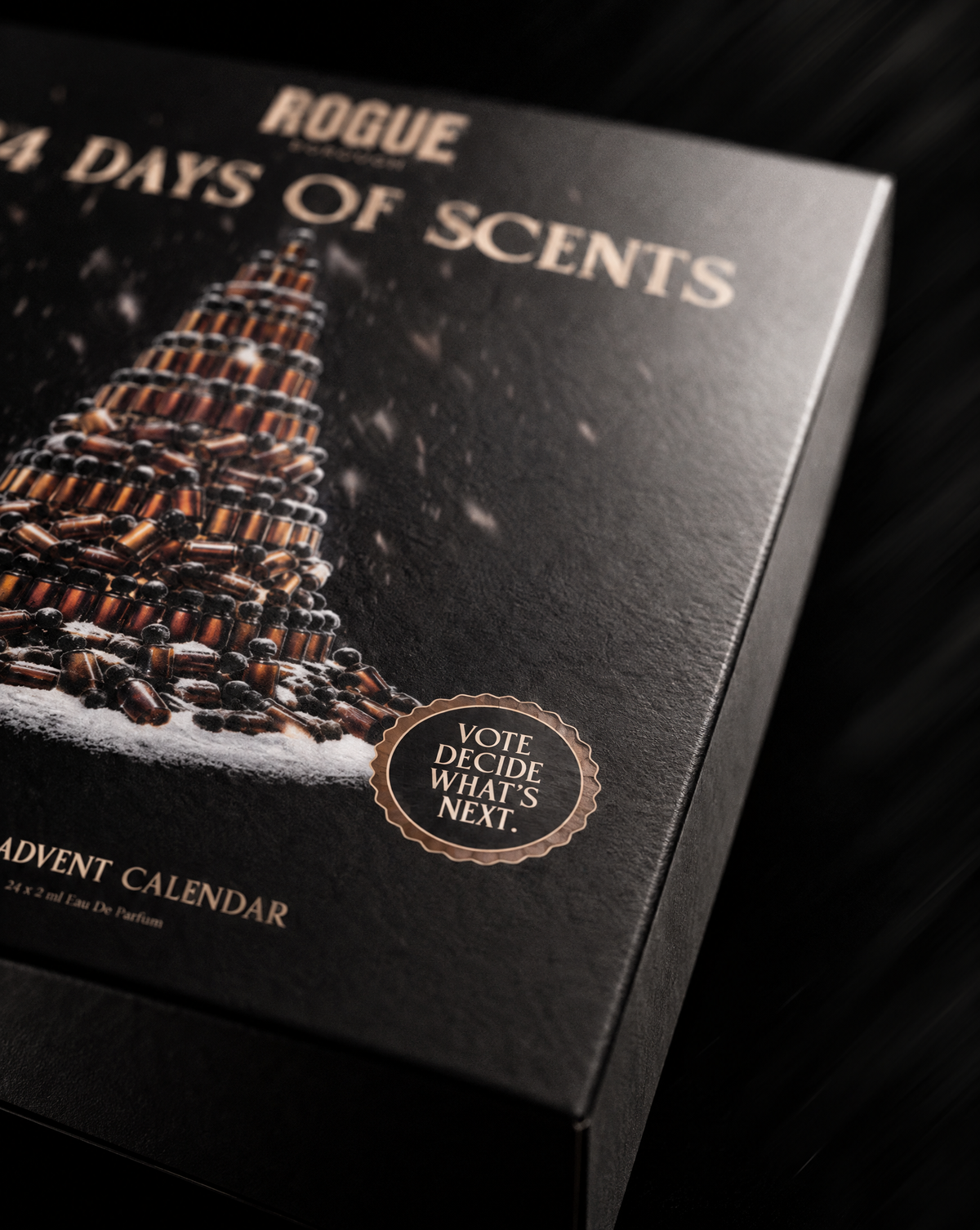 Close-up of the ROGUE Borough 24 Days of Scents advent calendar box with its Vote. Decide what's next. seal